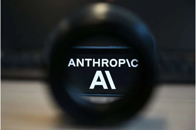 A photograph of the Anthropic AI logo seen through a magnifying lens.