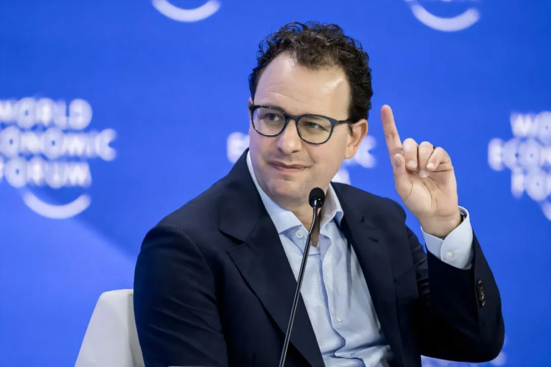 Anthropic chief executive Dario Amodei speaking at the World Economic Forum, photographed against a blue forum backdrop.